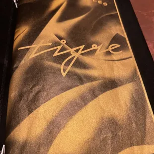 a close up of a menu on a table