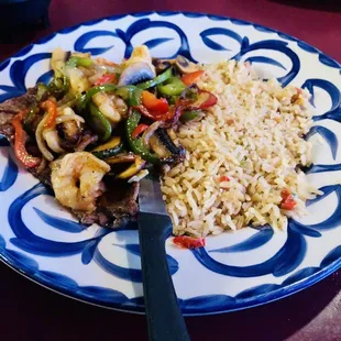 a plate of food with rice and vegetables