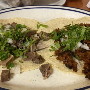 Left: taco de lengua Right: taco de chorizo