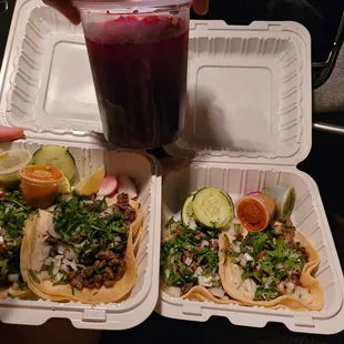 2 asada tacos, 1 carnitas, &amp; 1 al pastor.  we each got Agua de Jamaica (Hibiscus).