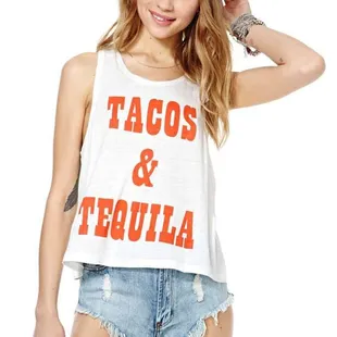 a woman wearing a white tank top with tacos and tequila on it