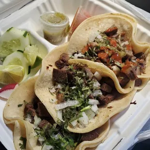Lengua tacos con todo. (beef tongue tacos with onions &amp; cilantro)