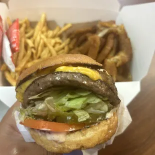 Cheese burger with fries and onions rings