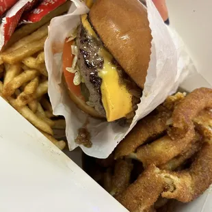 Cheeseburger with fries and onion rings