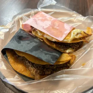 1 birria taco, 1 queso birria taco