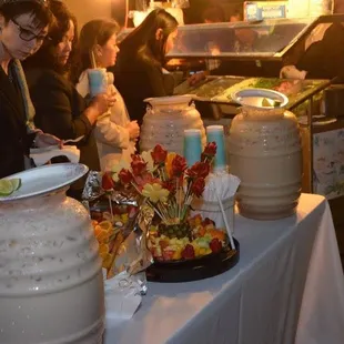 a woman serving food to a group of people