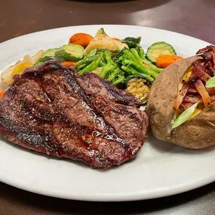 House rib eye ($21.95 USD) with "the works" ($3.00 USD)