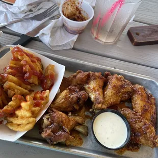 chicken wings and fries with ketchup