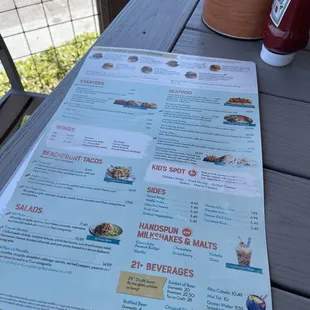 a menu on a picnic table