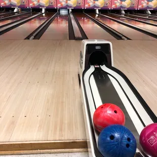 a bowling alley with bowling balls
