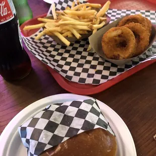 Tiki burger, onion rings, and fries