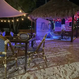 a tiki hut at night