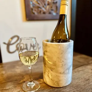 a bottle of wine and a glass of wine