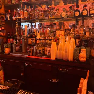 a bar filled with bottles of alcohol