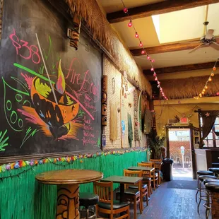 a restaurant with a chalkboard wall