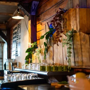 a bar with a bunch of glasses on the counter