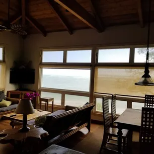 "Aloha Sunrise" unit. Another shot of the living room plus the dining room table set for 6 people.