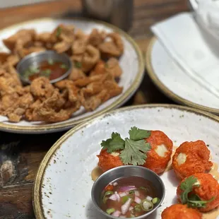 Chicken skin and quail eggs dipped in orange batter and deep fried