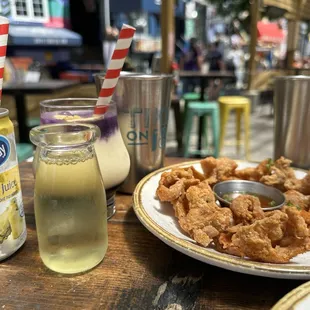 Pinacolada flight (Normal Pinacolada, Filtered Pinacolada, Ube Pinacolada) and Chicken skin