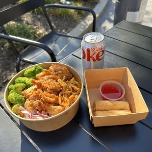 a bowl of food and a drink on a table