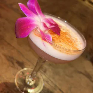 a drink with a flower in it