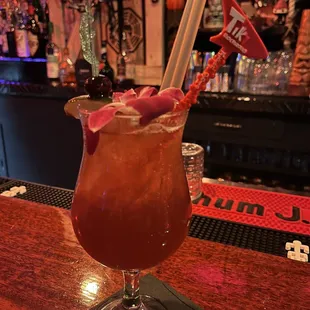 a drink in a glass on a bar