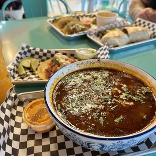 Birria ramen, fish taco, carne asada burrito and birria tacos