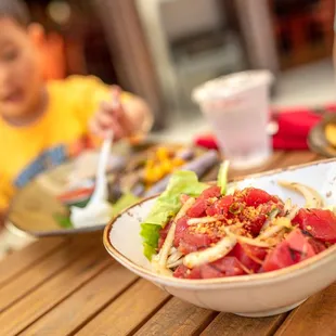 Hawaiian &apos;Ahi Poke $16 &quot;sustainable raw yellowfin tuna with soy sauce, sesame oil, inamona, limu &amp; local mixed greens&quot;