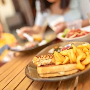 Smoked Marlin Melt Sandwich $16 &quot;tiki&apos;s kiawe smoked Hawaiian marlin dip, cheddar cheese, tomatoes, sourdough bread, sunomono, fries&quot;