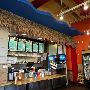 Fun, tropical island theme with the grass shack look over the ordering area!