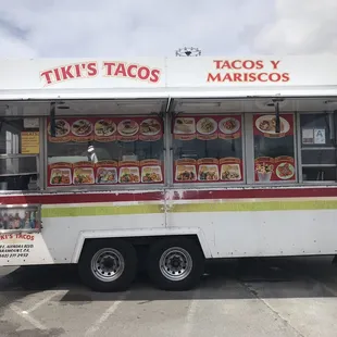 a taco truck in a parking lot