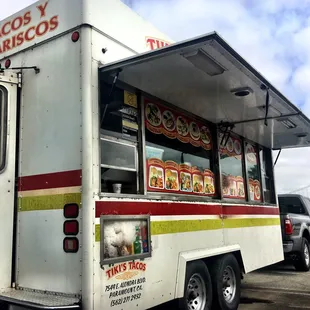 a taco truck parked in a parking lot