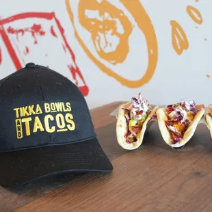 three tacos on a table