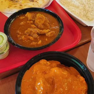 Naan, basmati rice, chicken curry, and butter chicken