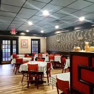 a dining room with tables and chairs