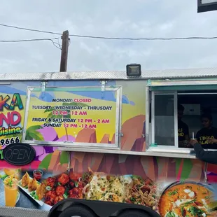a man ordering food from a food truck