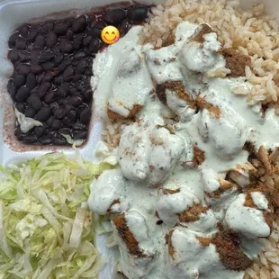 Chicken kebab plate with black beans and lettuce