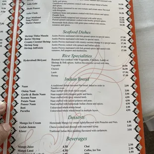 a hand holding a menu