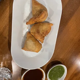 a plate of food with sauces