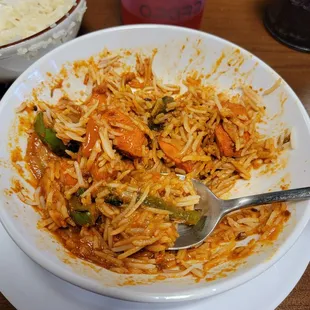 a bowl of food with a spoon