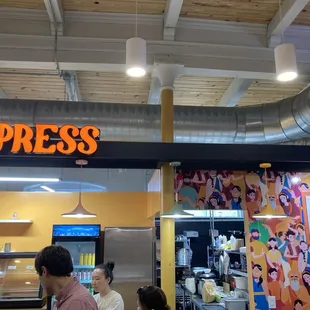 Cool and colorful mural by the menu/register!