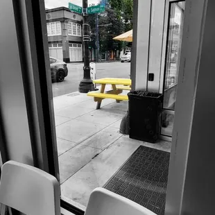 a black and white photo of a table and chairs