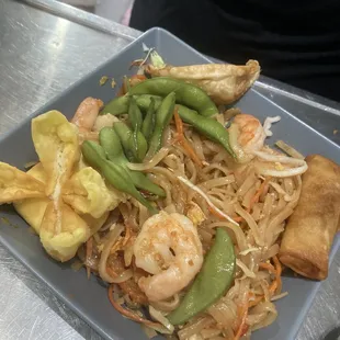 Pad Thai with crab Rangoon and egg rolls