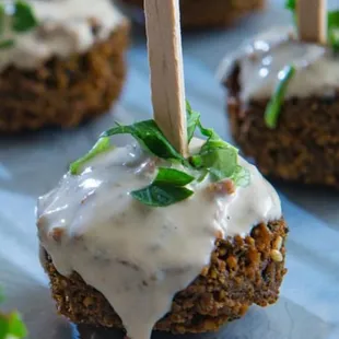 a close up of a meatball with a toothpick sticking out of it