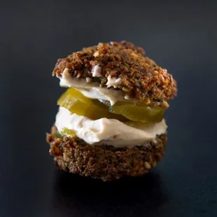 a sandwich with pickles and cream