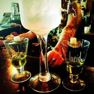 a man holding a glass of liquid