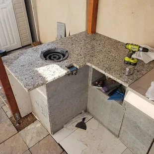 a kitchen with a sink and a stove