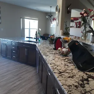 a large kitchen with granite countertops
