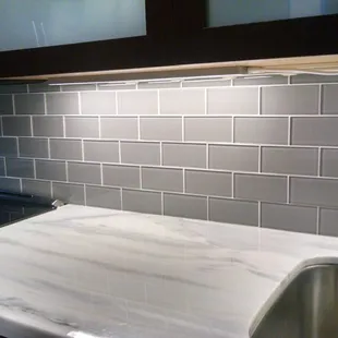 Glass subway tile &amp; marble counter