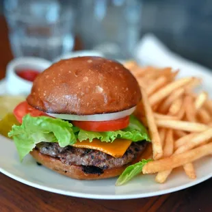 a hamburger and french fries on a plate